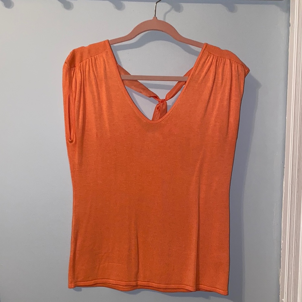 Sleeveless sweater top.